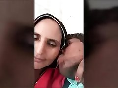 Villager mom kissing teen boy